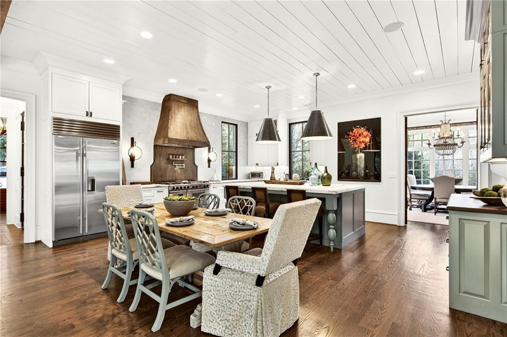 120 Burdette Trail Atlanta, GA 30327 - Photo 10 of 69 a dining room with kitchen island stainless steel appliances furniture a large window and kitchen view