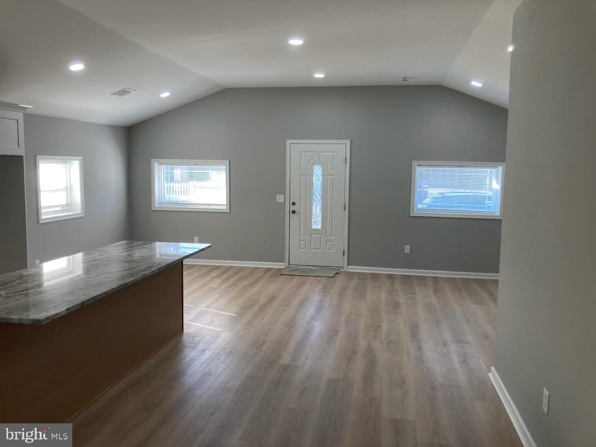 72 Alden Avenue Riverside, NJ 08075 - Photo 16 of 26 an empty room with wooden floor and windows