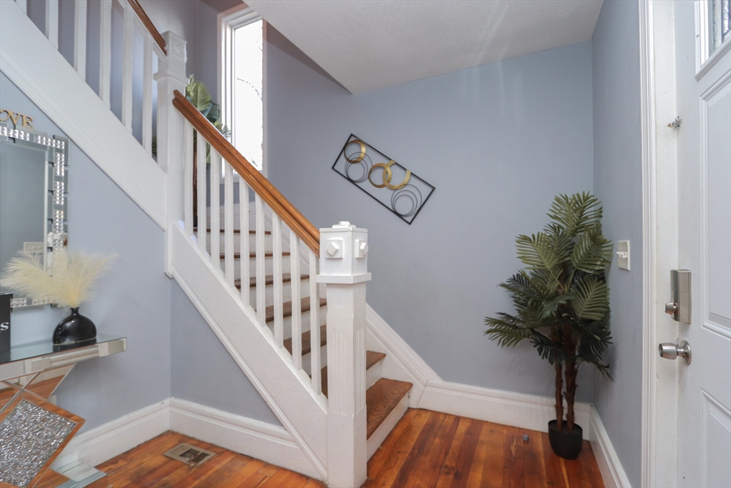 58 Willard Avenue Springfield, MA 01109 - Photo 17 of 32 a view of entryway and hall with wooden floor