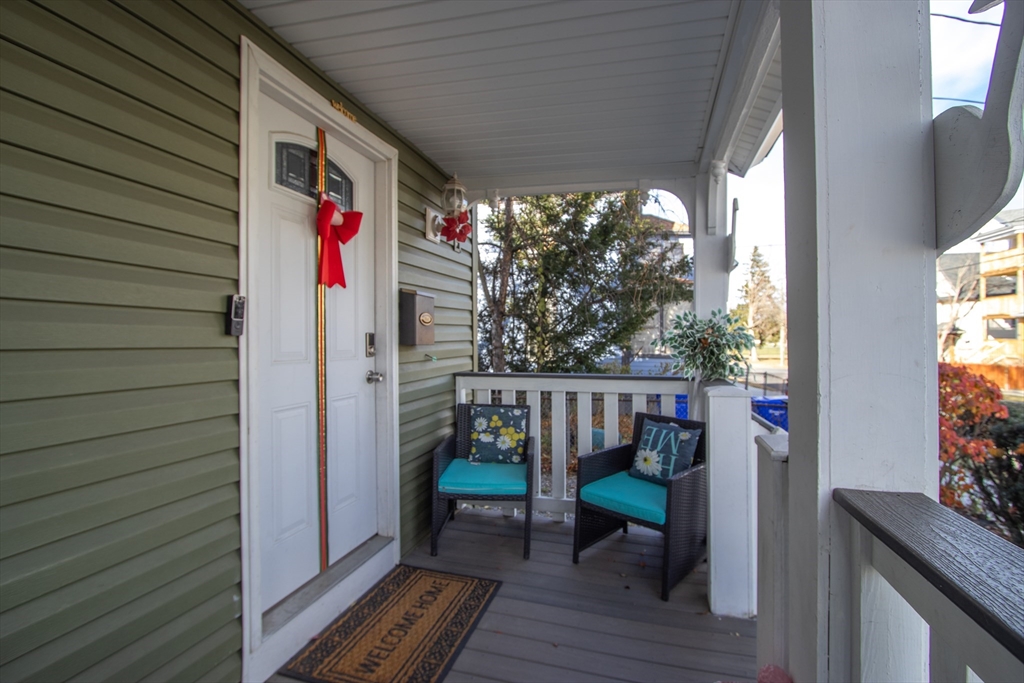 58 Willard Avenue Springfield, MA 01109 - Photo 2 of 32 a view of two chairs in a balcony