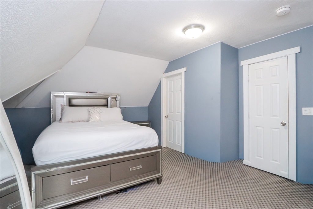 58 Willard Avenue Springfield, MA 01109 - Photo 27 of 32 a bedroom with a bed and a window