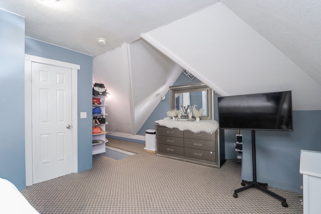 58 Willard Avenue Springfield, MA 01109 - Photo 28 of 32 a view of a livingroom with furniture and a flat screen tv