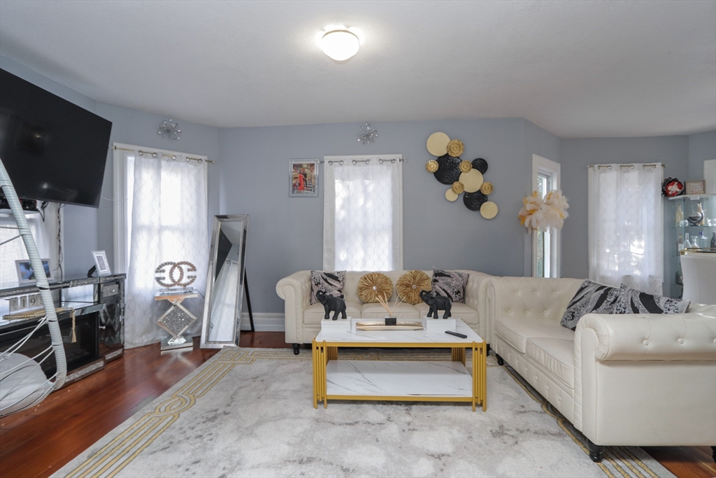58 Willard Avenue Springfield, MA 01109 - Photo 5 of 32 a living room with furniture and a flat screen tv