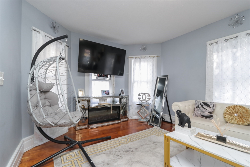 58 Willard Avenue Springfield, MA 01109 - Photo 6 of 32 a living room with furniture and a flat screen tv