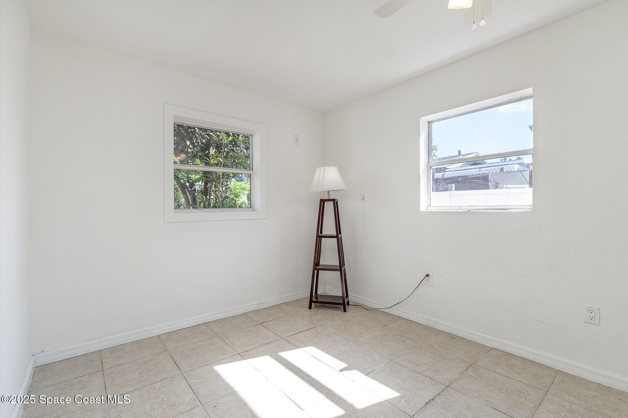 2234 Post Road Melbourne, FL 32935 - Photo 11 of 29 a view of room with window and stairs