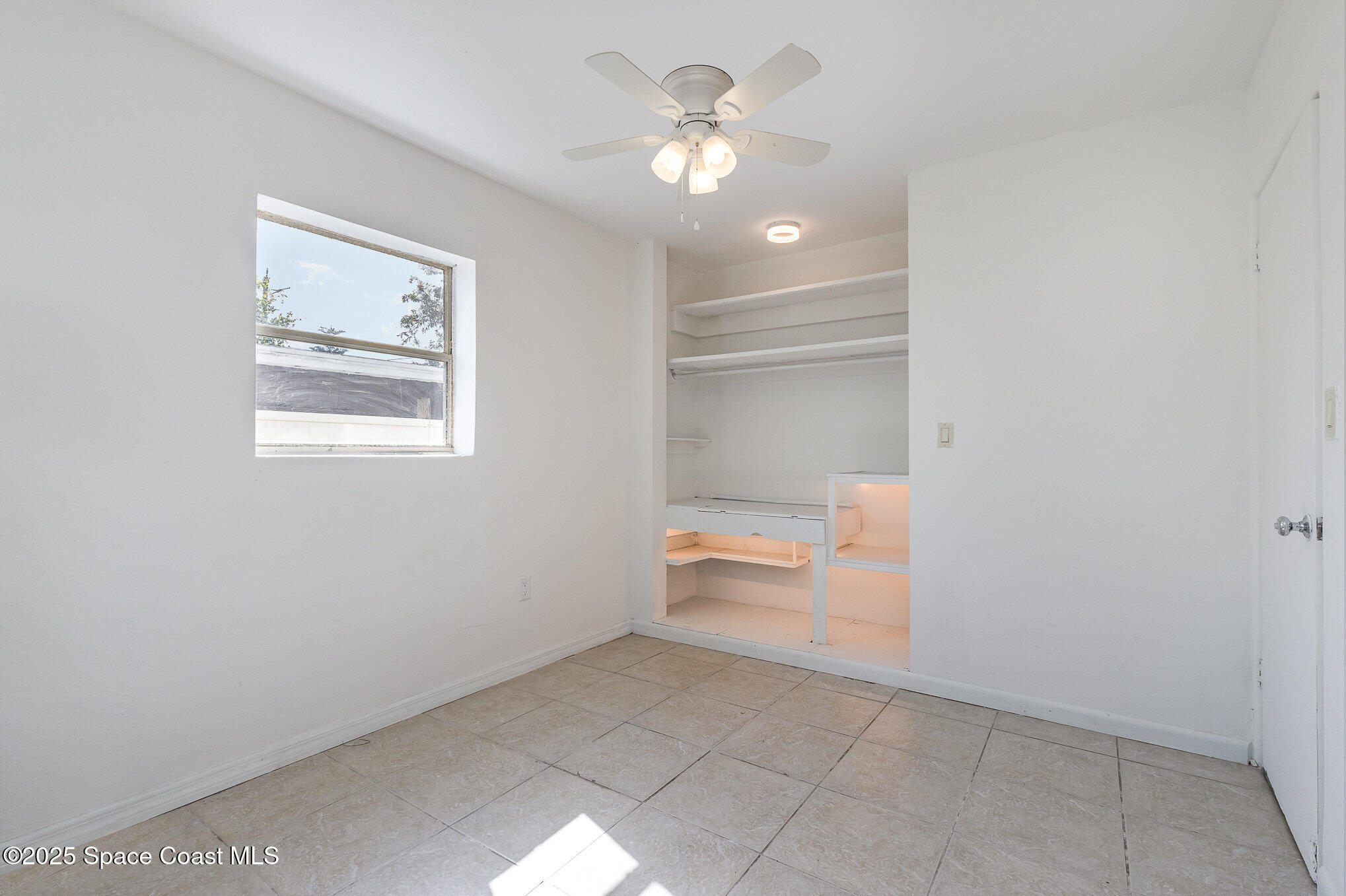 2234 Post Road Melbourne, FL 32935 - Photo 12 of 29 a view of room and chandelier fan