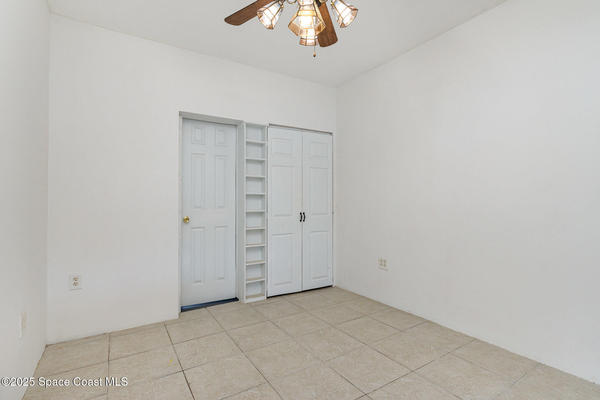 2234 Post Road Melbourne, FL 32935 - Photo 20 of 29 an empty room with a ceiling fan