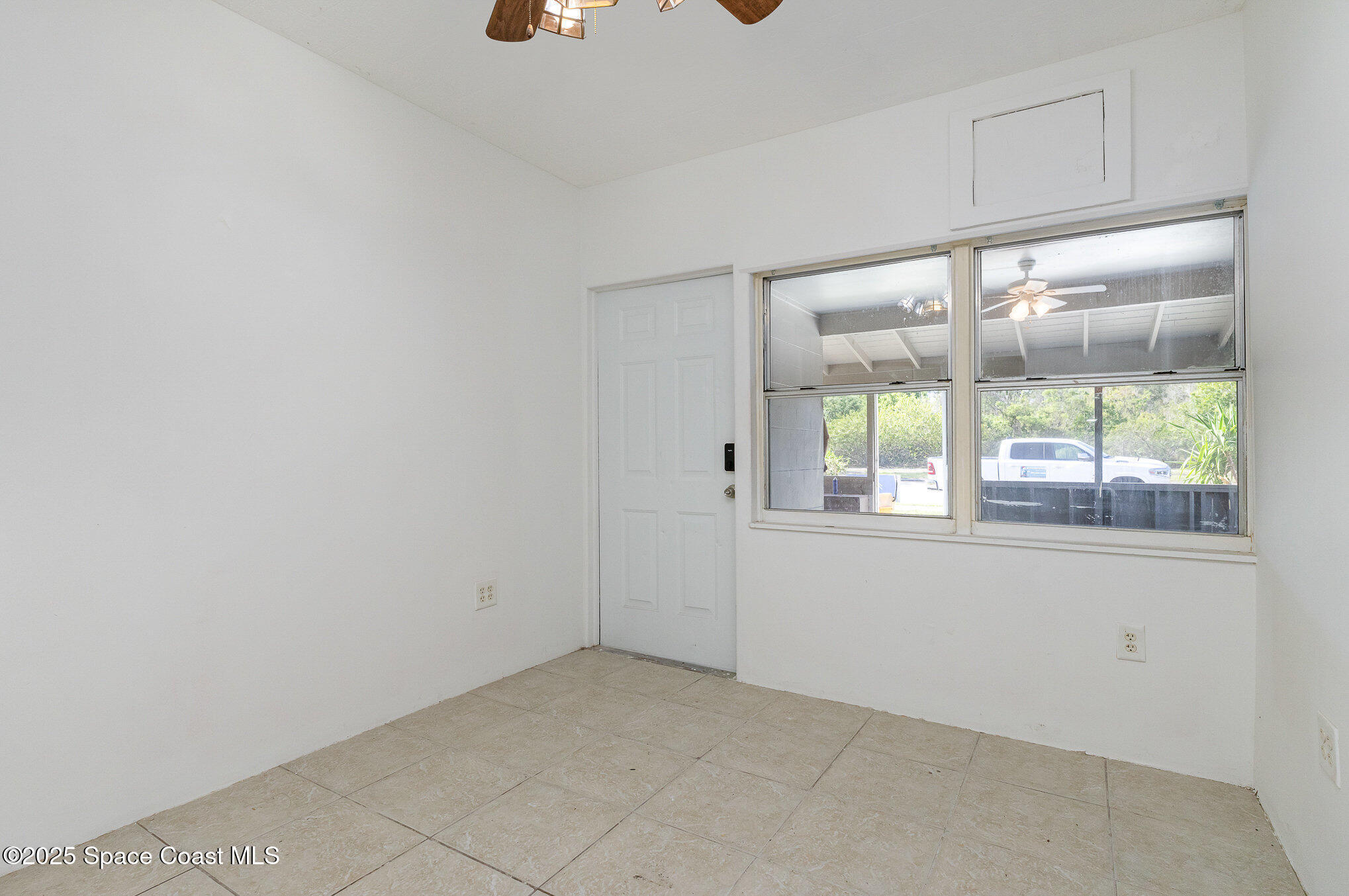 2234 Post Road Melbourne, FL 32935 - Photo 21 of 29 an empty room with a window