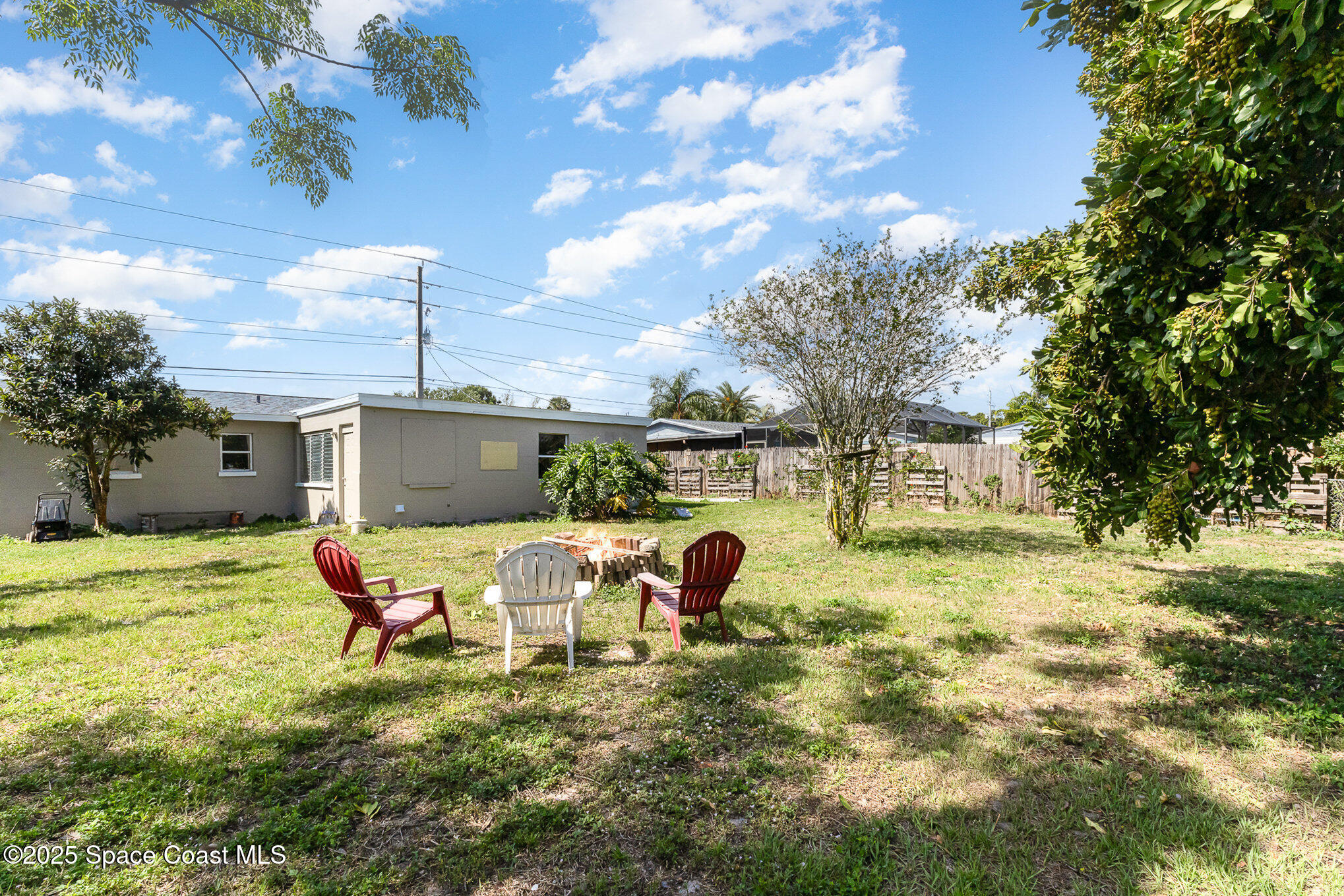 2234 Post Road Melbourne, FL 32935 - Photo 23 of 29 a backyard of a house with table and chairs