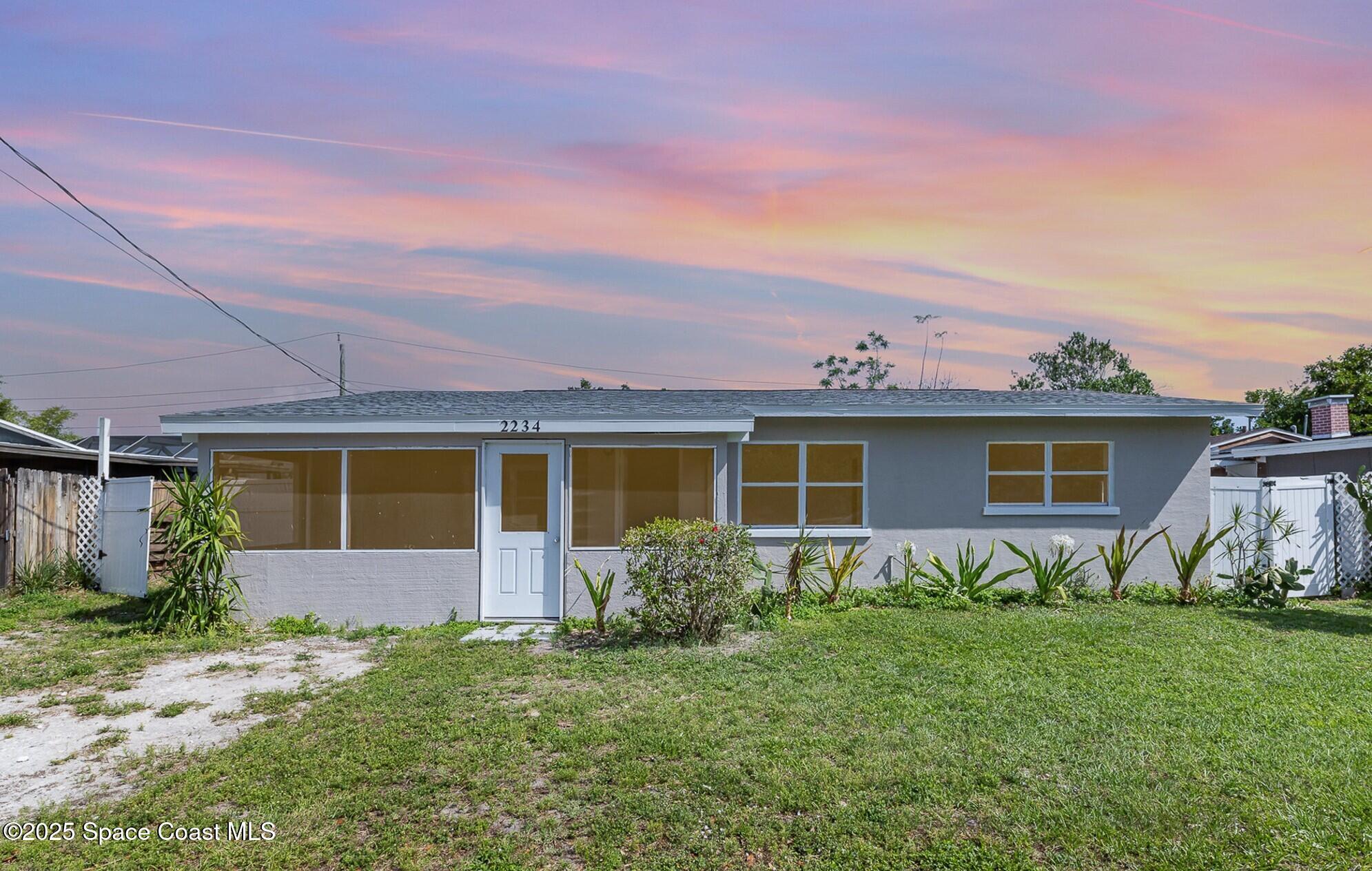 2234 Post Road Melbourne, FL 32935 - Photo 29 of 29 front view of house with a yard