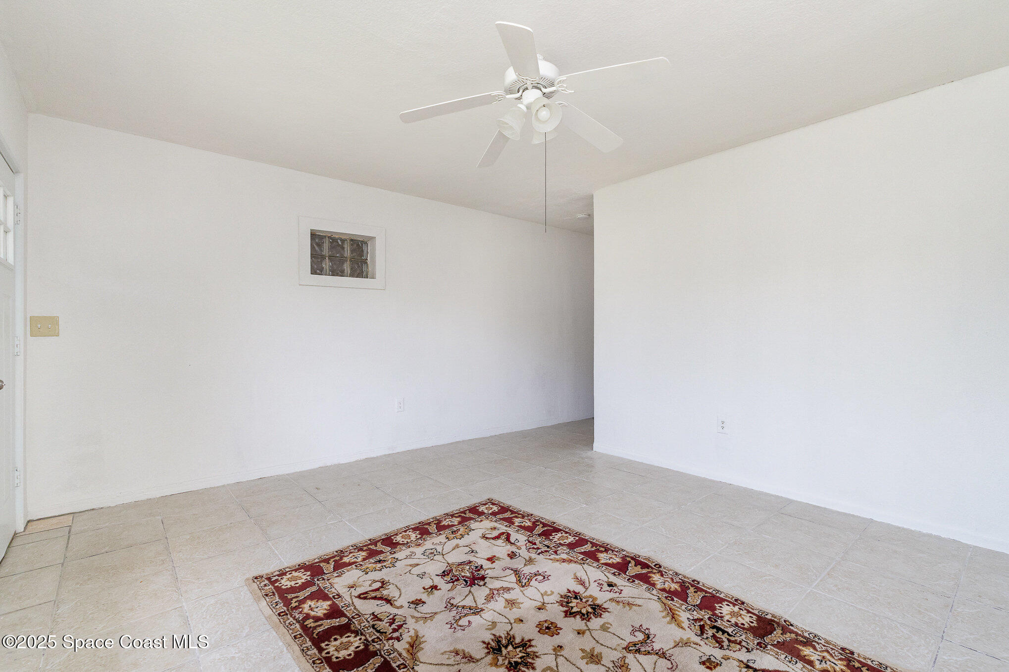2234 Post Road Melbourne, FL 32935 - Photo 4 of 29 an empty room with a ceiling fan