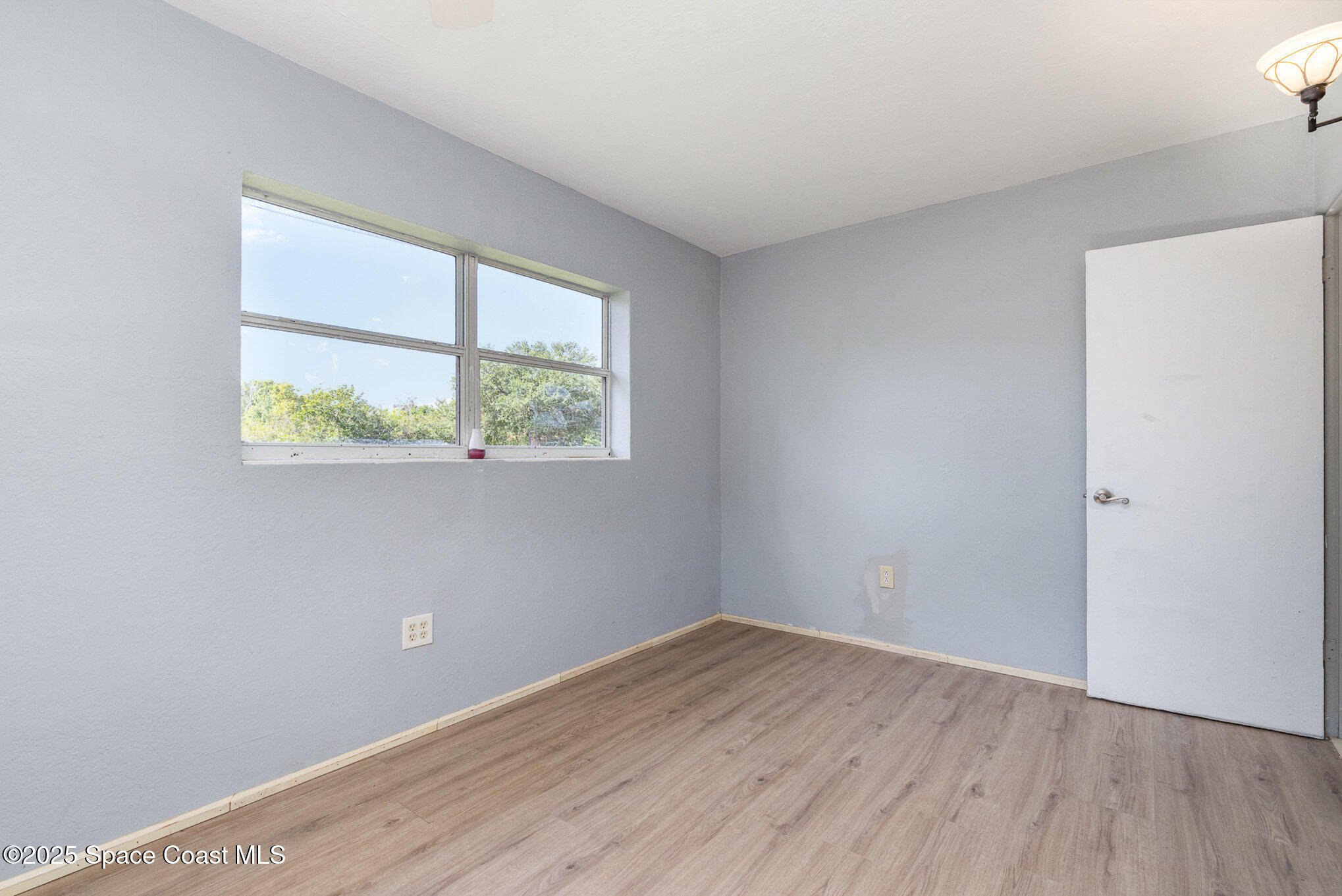 2234 Post Road Melbourne, FL 32935 - Photo 9 of 29 an empty room with a window