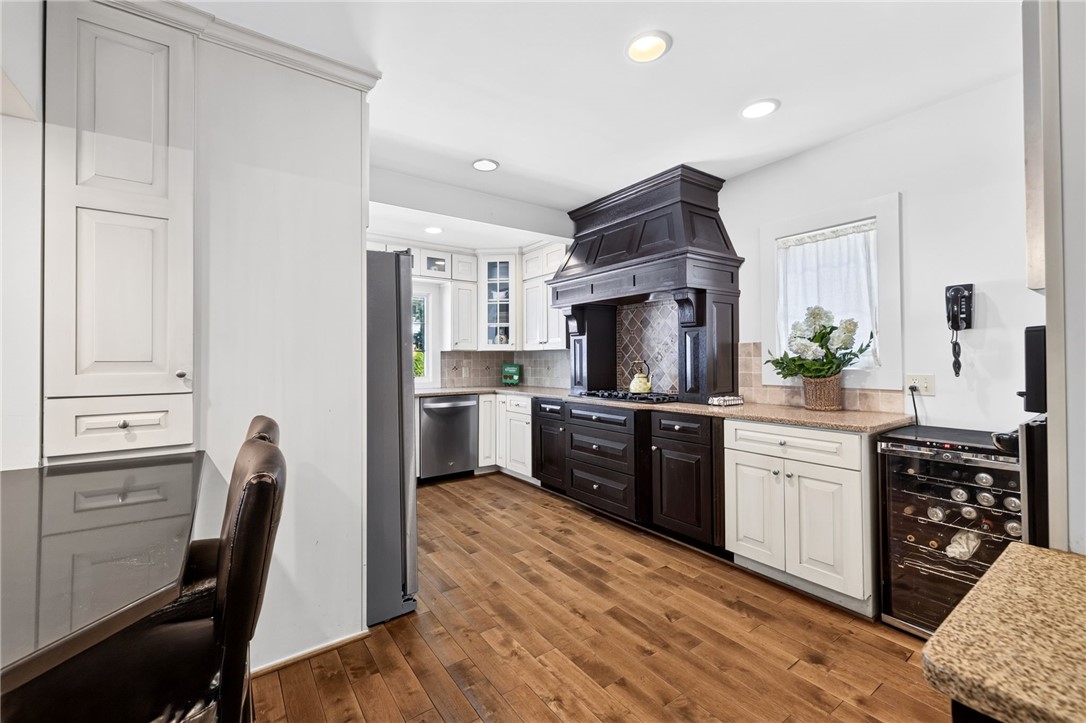 138 Dorchester Road Rochester, NY 14610 - Photo 16 of 41 The Gourmet Kitchen presents a mix of dark & light slow close wood cabinetry & custom Birch floors!