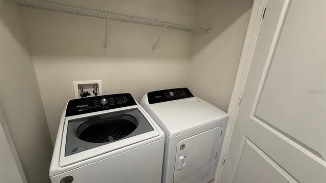 a utility room with dryer and washer
