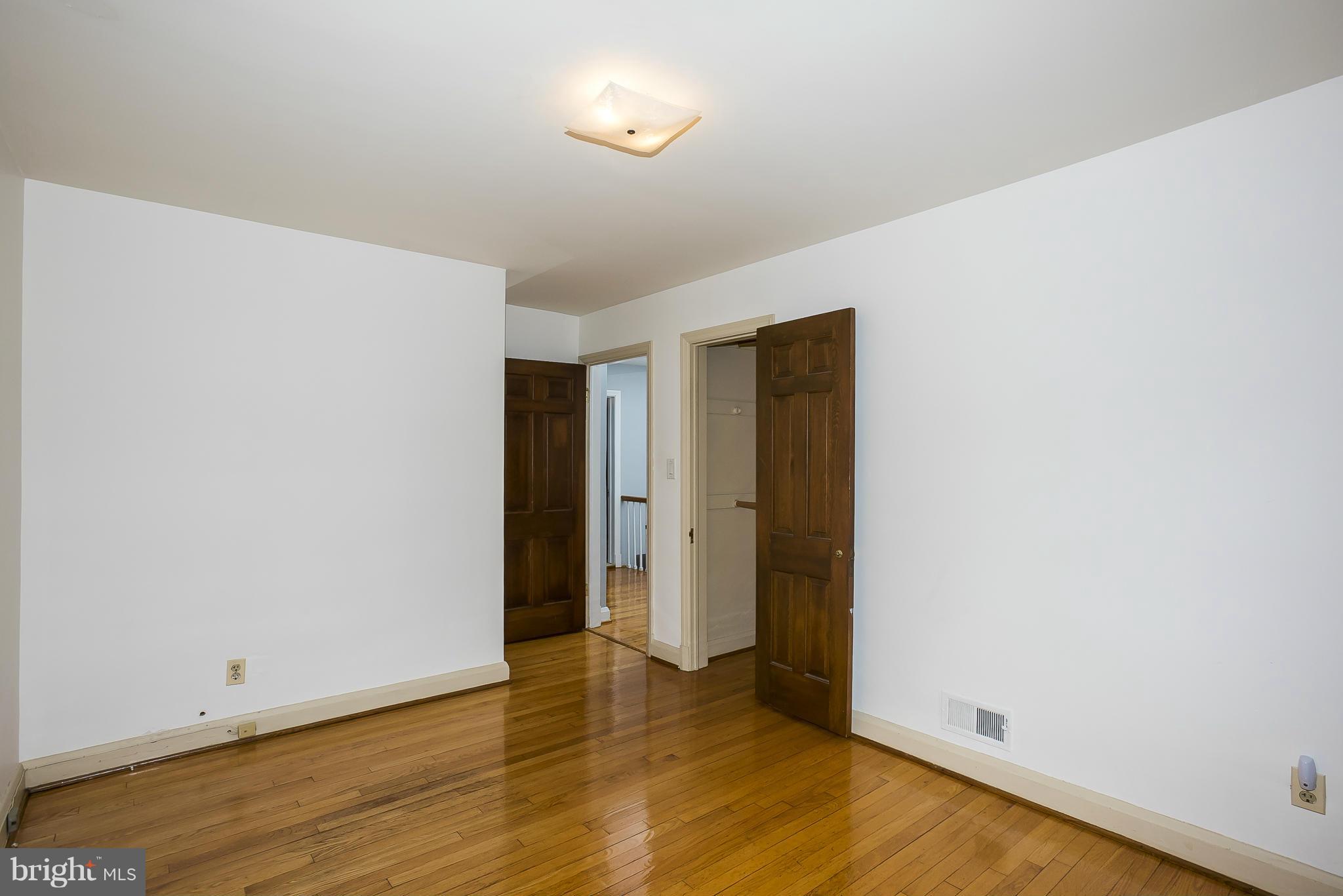 354 Greenlow Road Catonsville, MD 21228 - Photo 13 of 20 a view of an empty room with wooden floor and closet