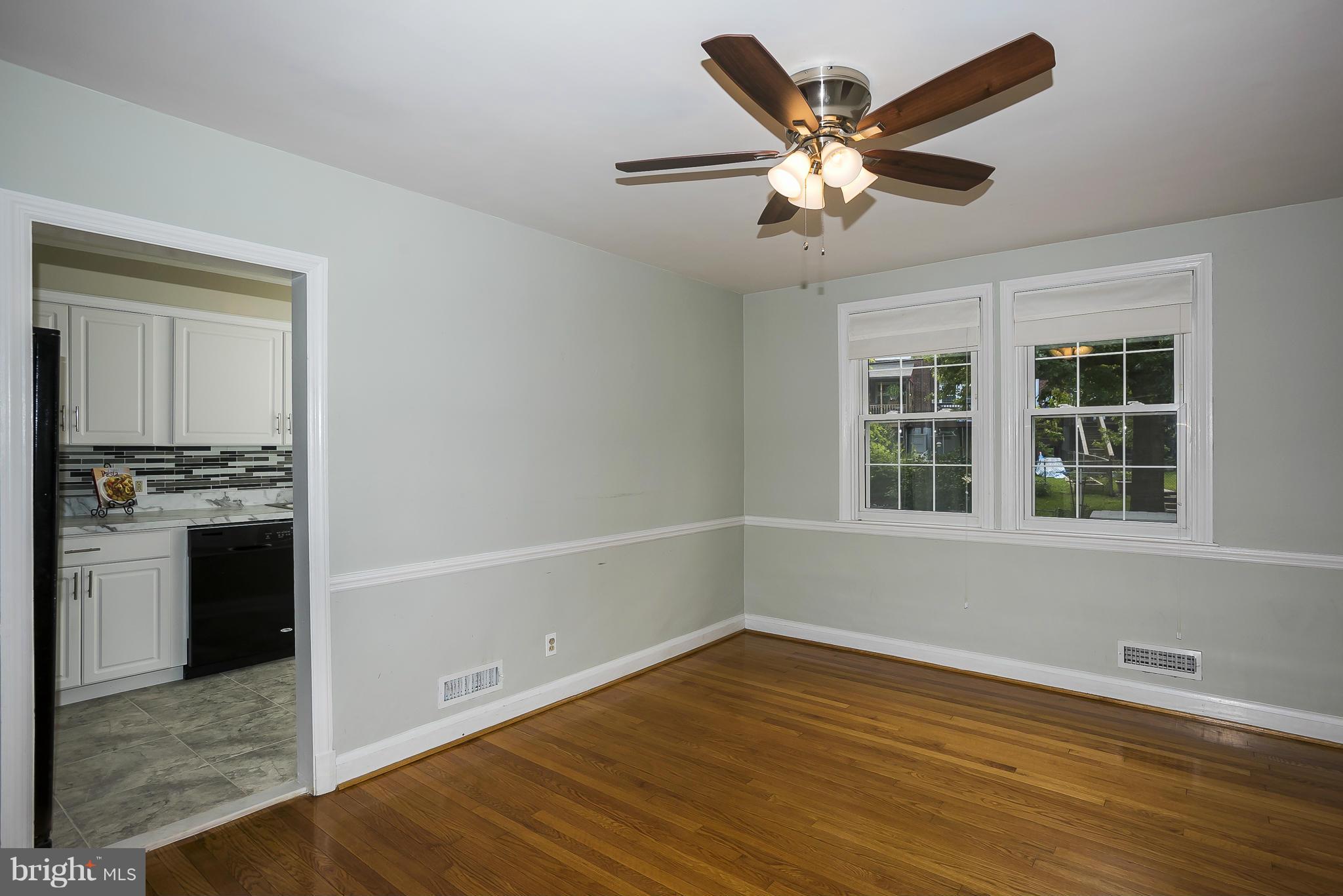 354 Greenlow Road Catonsville, MD 21228 - Photo 9 of 20 a view of an empty room with window and wooden floor