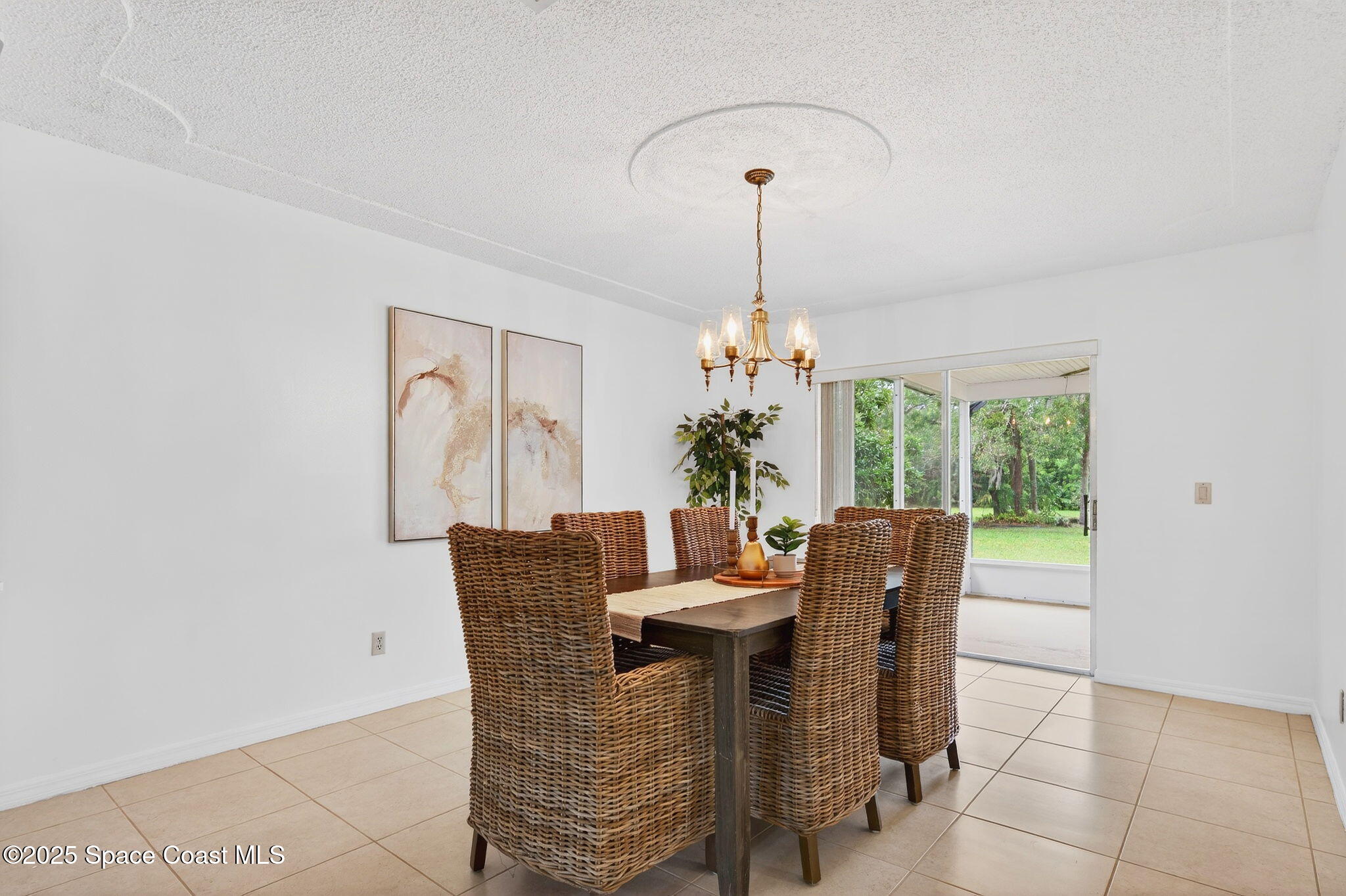 4356 Mustang Road Melbourne, FL 32934 - Photo 16 of 39 Dining Room with sliders