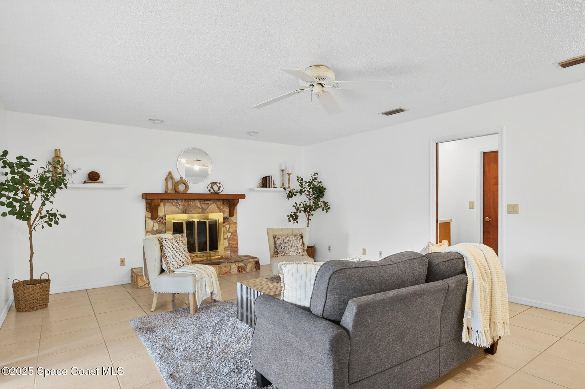 4356 Mustang Road Melbourne, FL 32934 - Photo 20 of 39 Family Room w/Fireplace