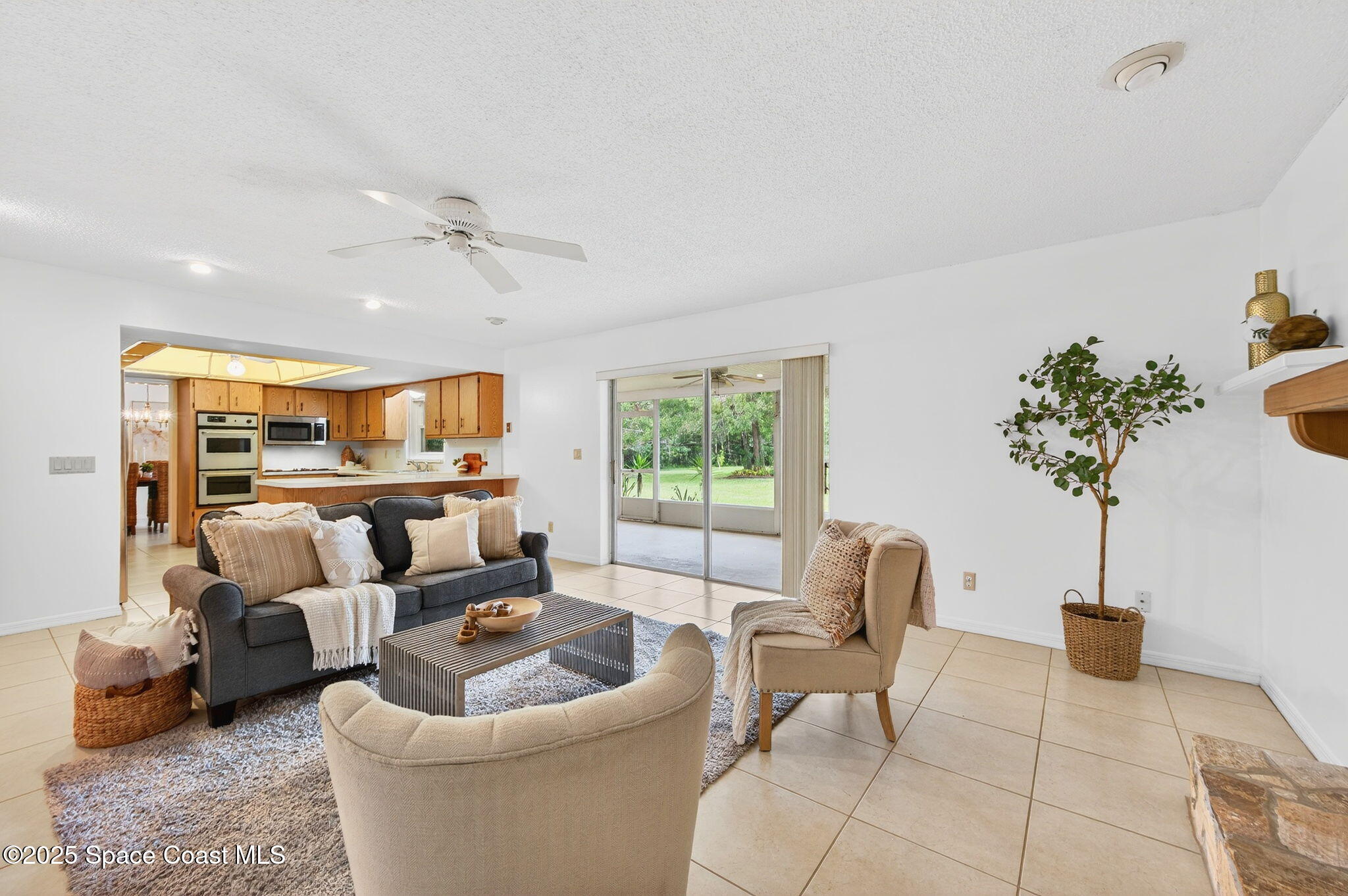 4356 Mustang Road Melbourne, FL 32934 - Photo 22 of 39 Family Room with sliders