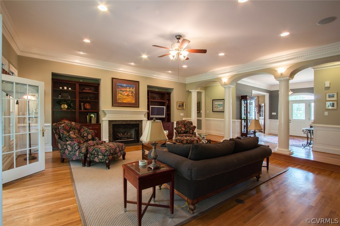 13420 Stonegate Road Midlothian, VA 23113 - Photo 5 of 41 a living room with furniture a fireplace and wooden floor