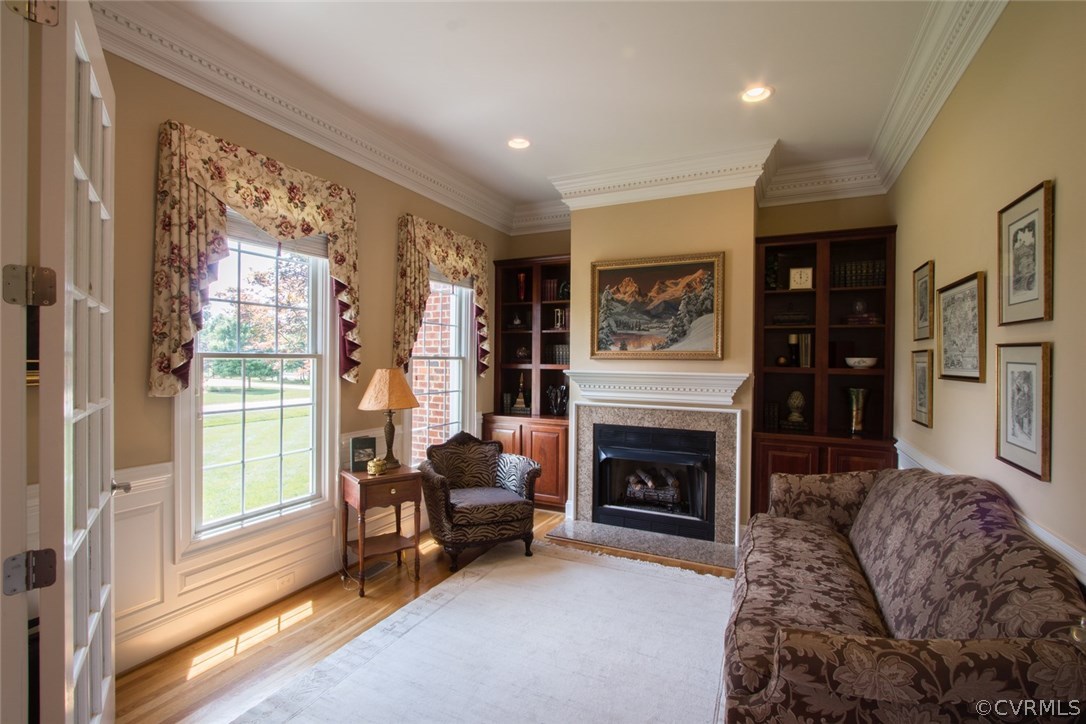 13420 Stonegate Road Midlothian, VA 23113 - Photo 8 of 41 a living room with furniture and a fireplace