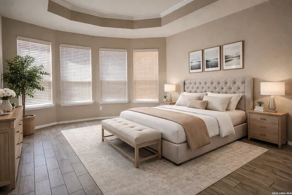 a spacious bedroom with a bed and a large window