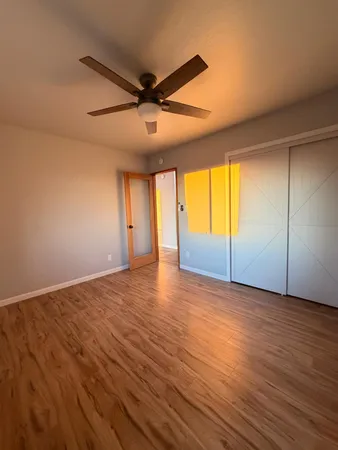 a bathroom with a double vanity sink mirror and toilet