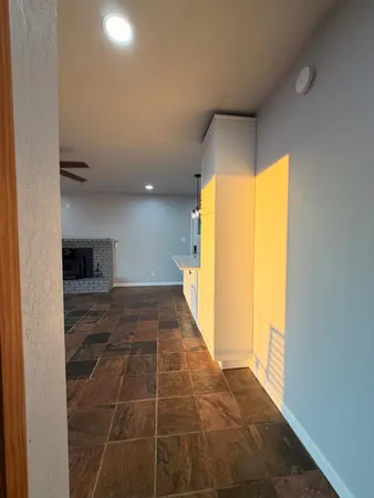 a bathroom with a bathtub a sink a toilet and a mirror