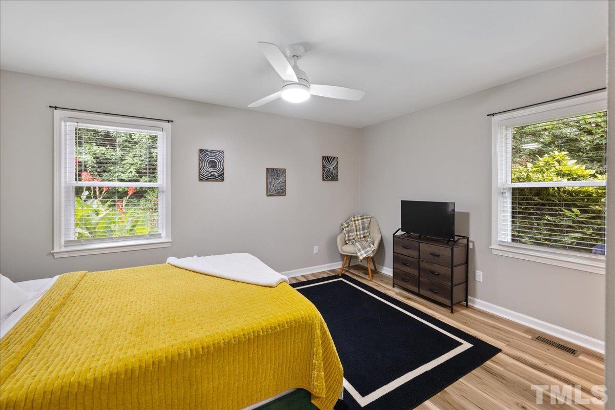 3101 Crandon Lane Raleigh, NC 27604 - Photo 12 of 18 a bed room with a bed and a television