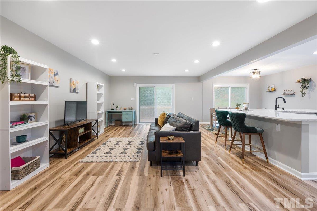 3101 Crandon Lane Raleigh, NC 27604 - Photo 3 of 18 a living room with furniture and a flat screen tv