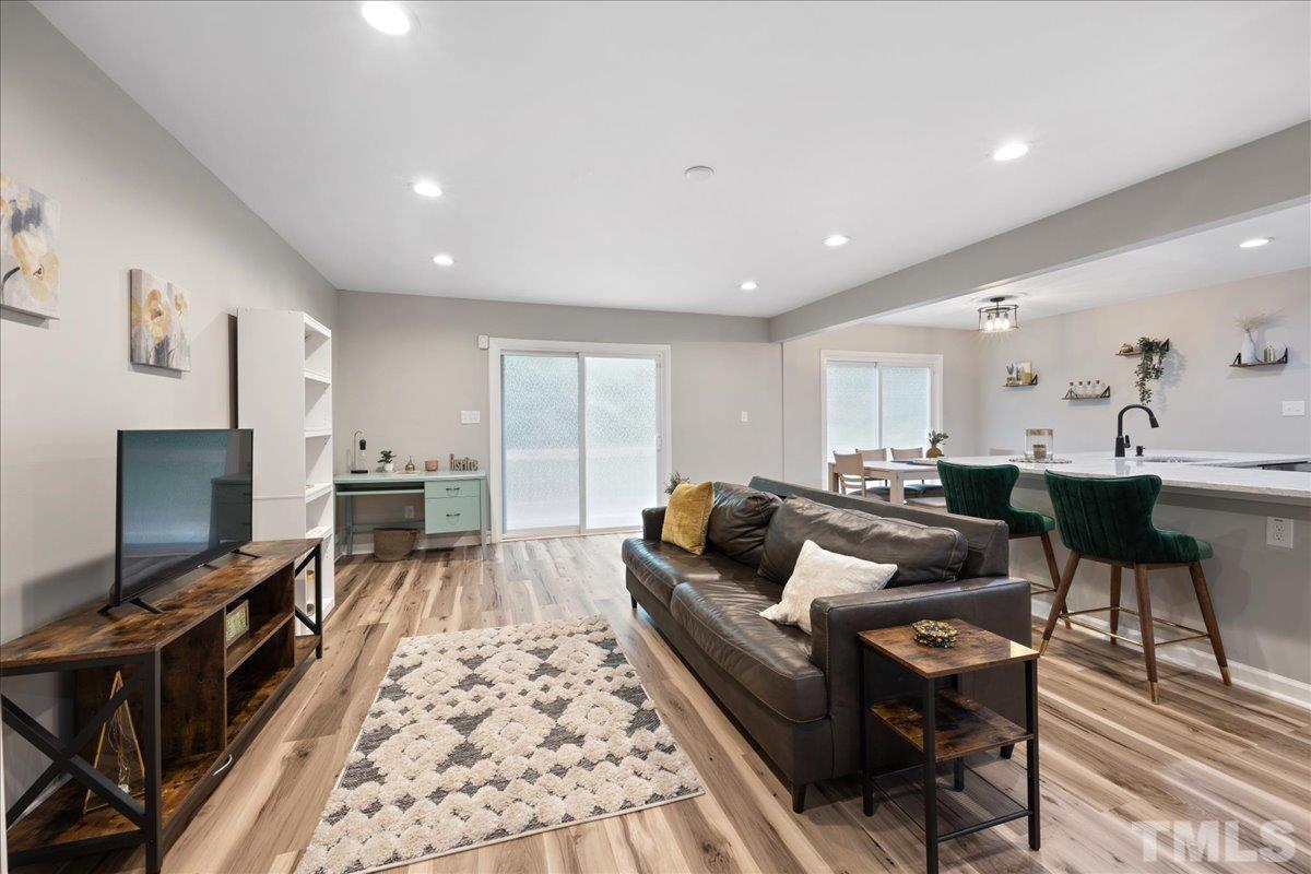 3101 Crandon Lane Raleigh, NC 27604 - Photo 4 of 18 a living room with furniture and a flat screen tv