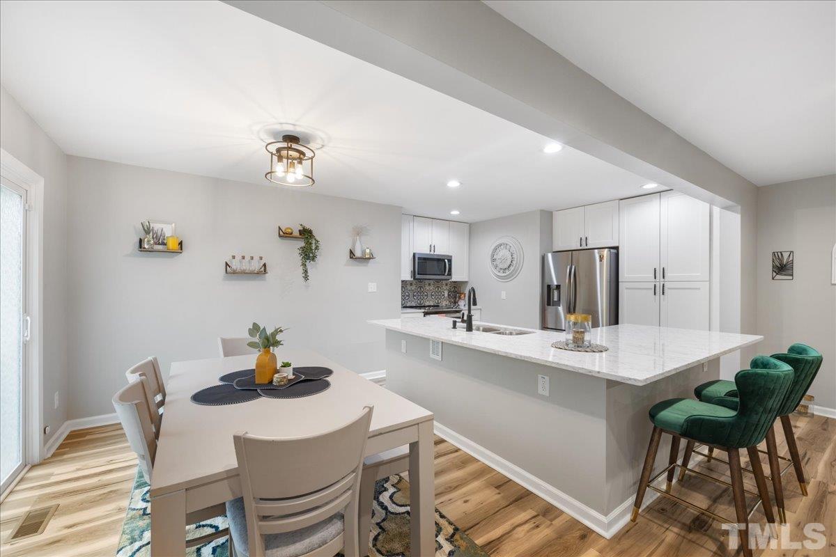 3101 Crandon Lane Raleigh, NC 27604 - Photo 5 of 18 a view of a dining room with furniture