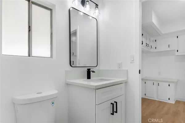 a bathroom with a glass shower door