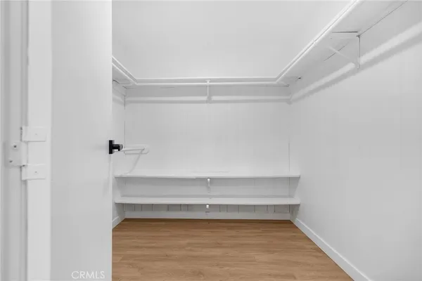 a kitchen with cabinets and a window