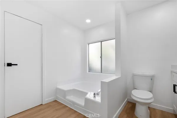 a bathroom with a shower and a mirror