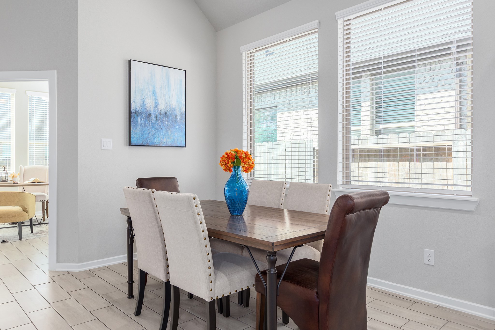 107 Yellow Perch Way Conroe, TX 77318 - Photo 14 of 44 Dining area conveniently located off the family room and adjacent to the study, offering a comfortable and functional space for everyday meals and gatherings.