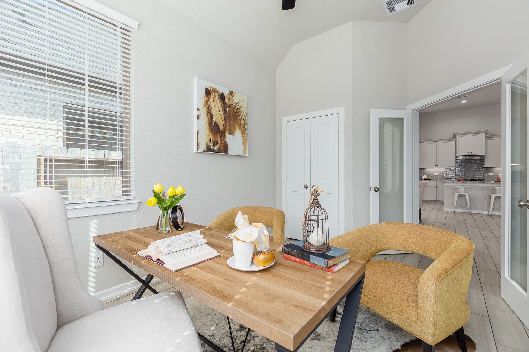 107 Yellow Perch Way Conroe, TX 77318 - Photo 17 of 44 Private study featuring tile flooring, natural light, and convenient access to the main living areas, ideal for a home office or quiet workspace.