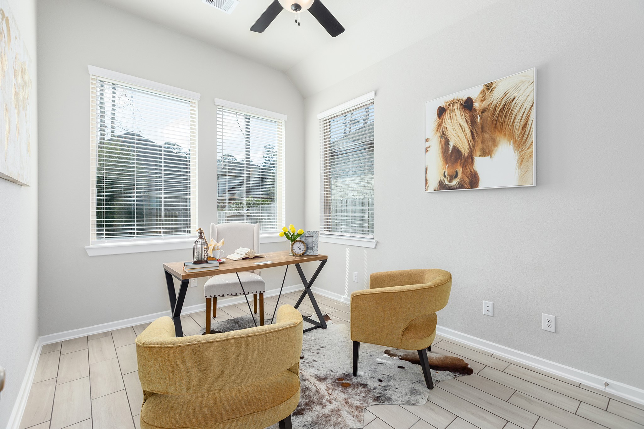 107 Yellow Perch Way Conroe, TX 77318 - Photo 18 of 44 This bright study features vaulted ceilings and abundant windows, creating an ideal environment for a home office or creative workspace.