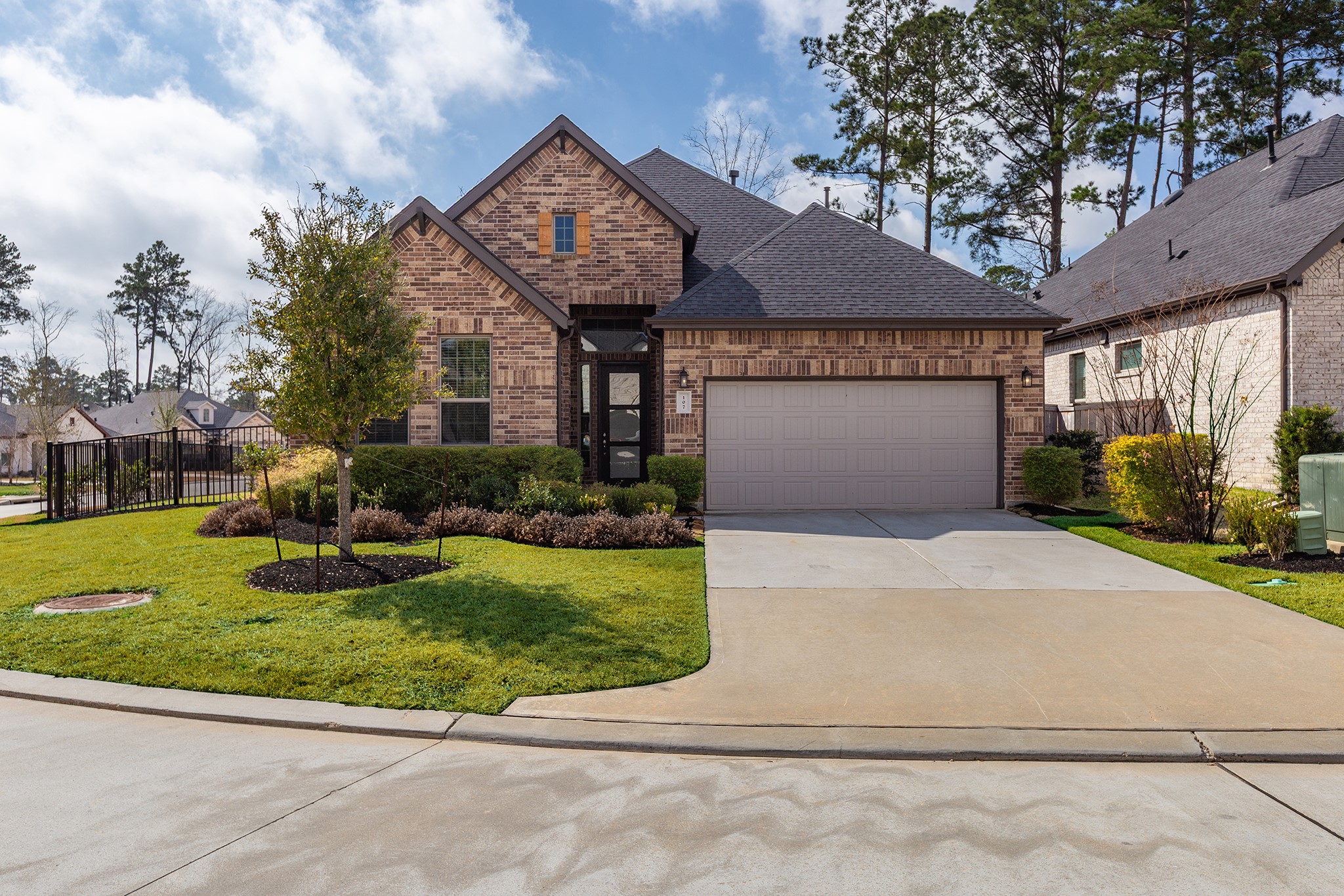 107 Yellow Perch Way Conroe, TX 77318 - Photo 3 of 44 Additional exterior angle highlighting the home’s setting and lot position.