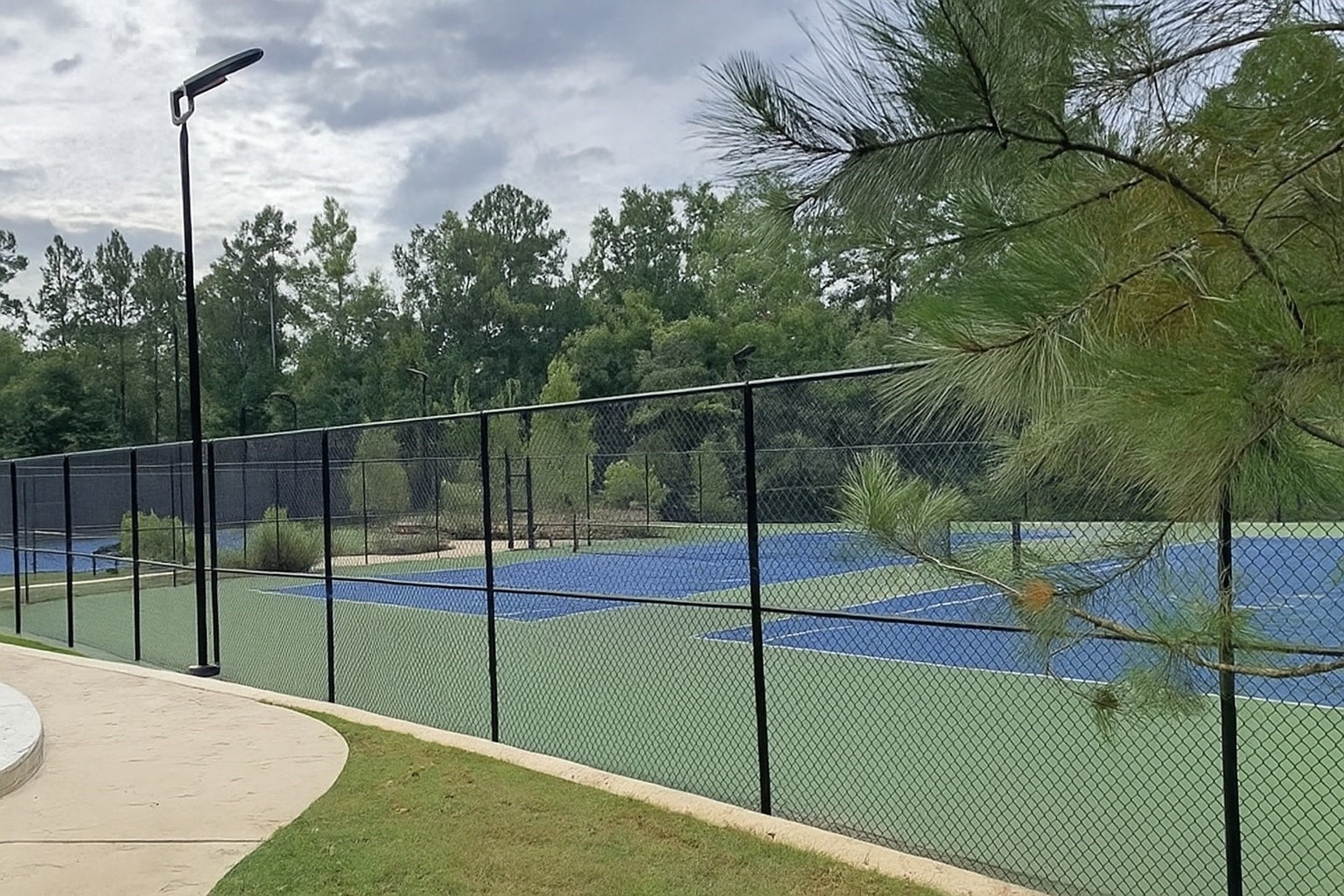 107 Yellow Perch Way Conroe, TX 77318 - Photo 44 of 44 The Woodlands Hills community sports courts offering dedicated space for recreation and active outdoor enjoyment for residents.