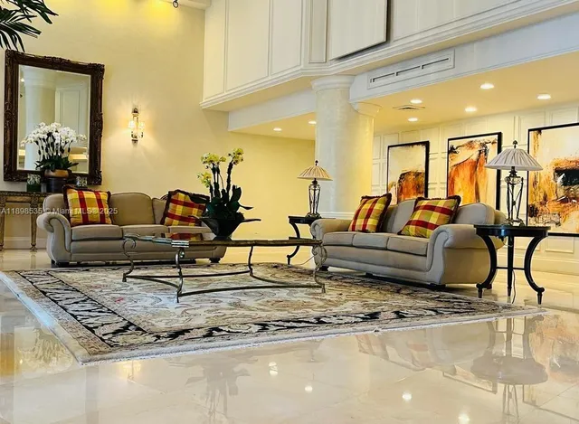 a living room with furniture and a rug
