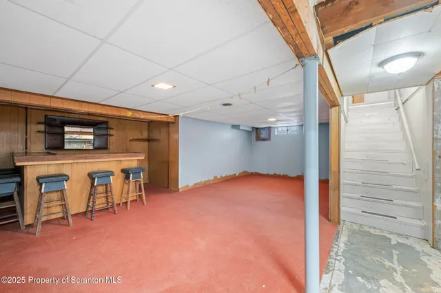 a view of a livingroom with furniture and a ceiling fan