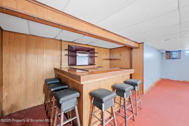a kitchen with a table and chairs in it
