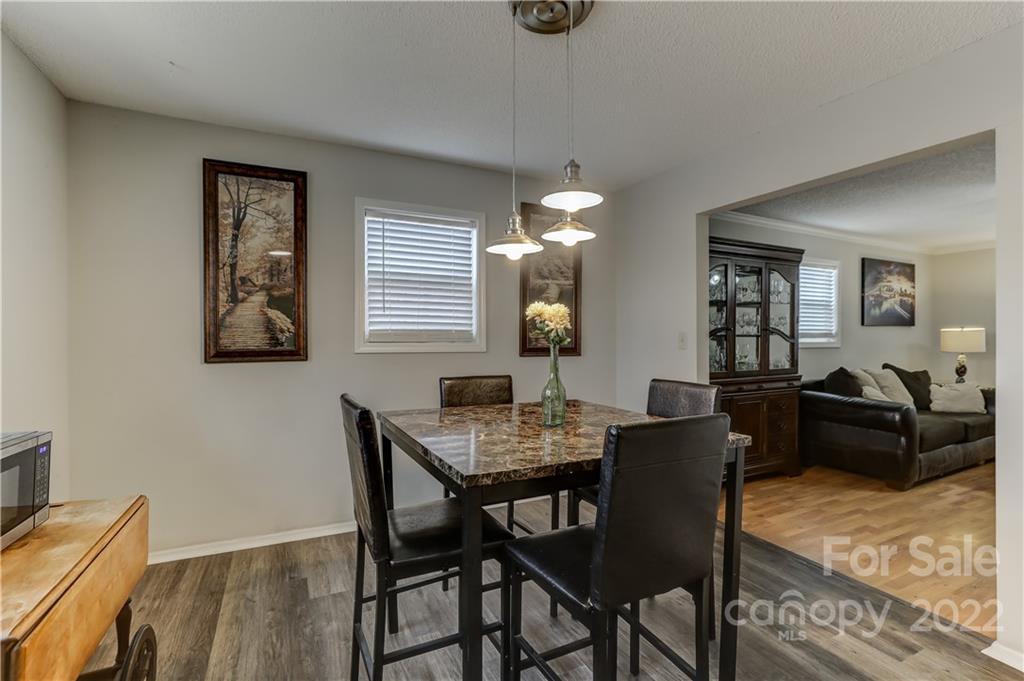 8216 Pine Oak Road Waxhaw, NC 28173 - Photo 11 of 39 a view of a dining room with furniture