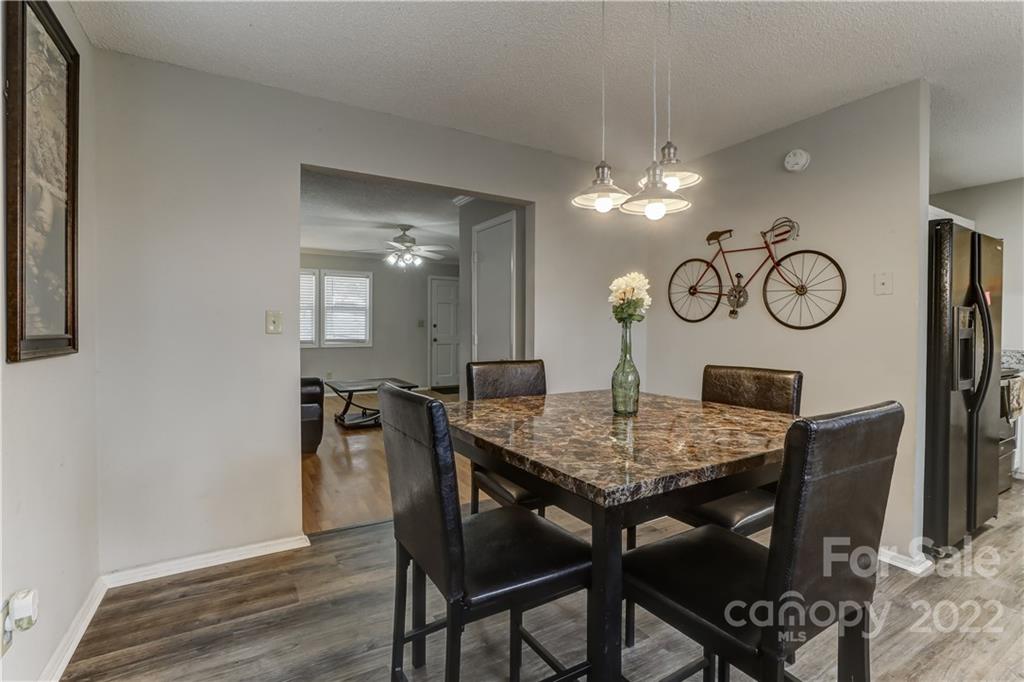8216 Pine Oak Road Waxhaw, NC 28173 - Photo 12 of 39 a view of a dining room and kitchen