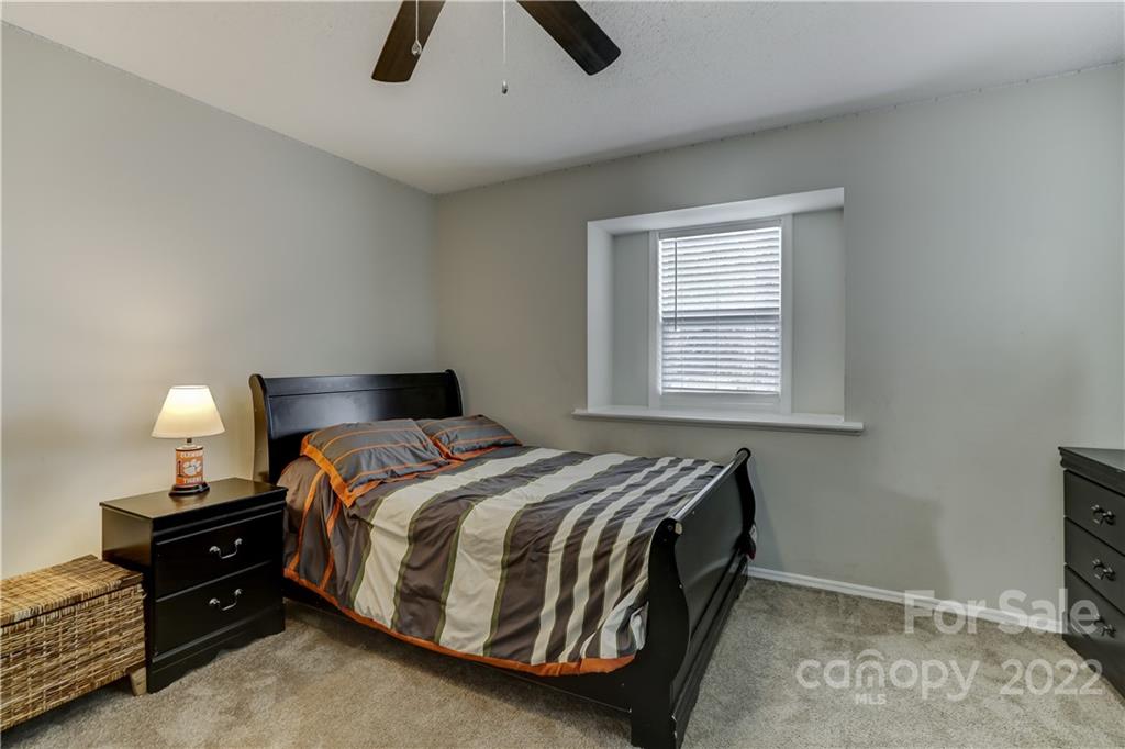 8216 Pine Oak Road Waxhaw, NC 28173 - Photo 24 of 39 a bedroom with a bed and a window
