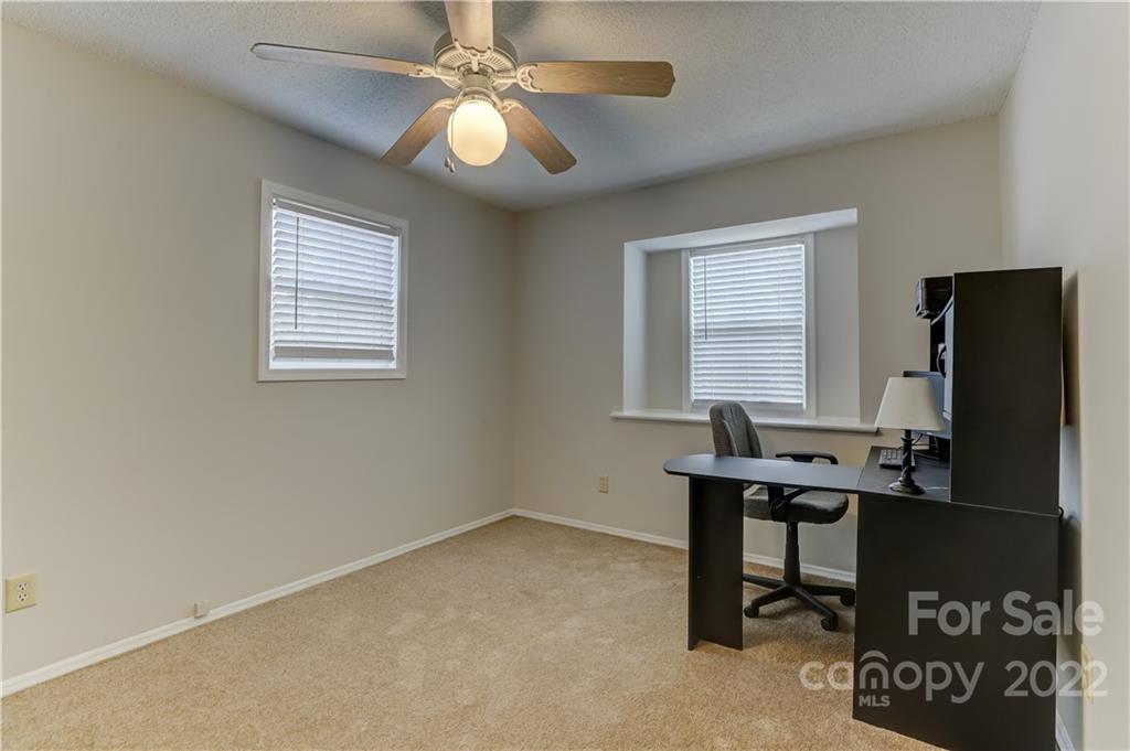 8216 Pine Oak Road Waxhaw, NC 28173 - Photo 26 of 39 a view of a workspace with furniture and a window
