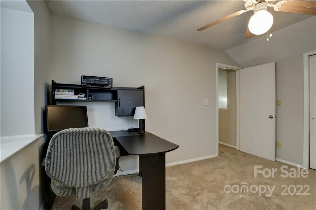 8216 Pine Oak Road Waxhaw, NC 28173 - Photo 28 of 39 a workspace with furniture and wooden floor