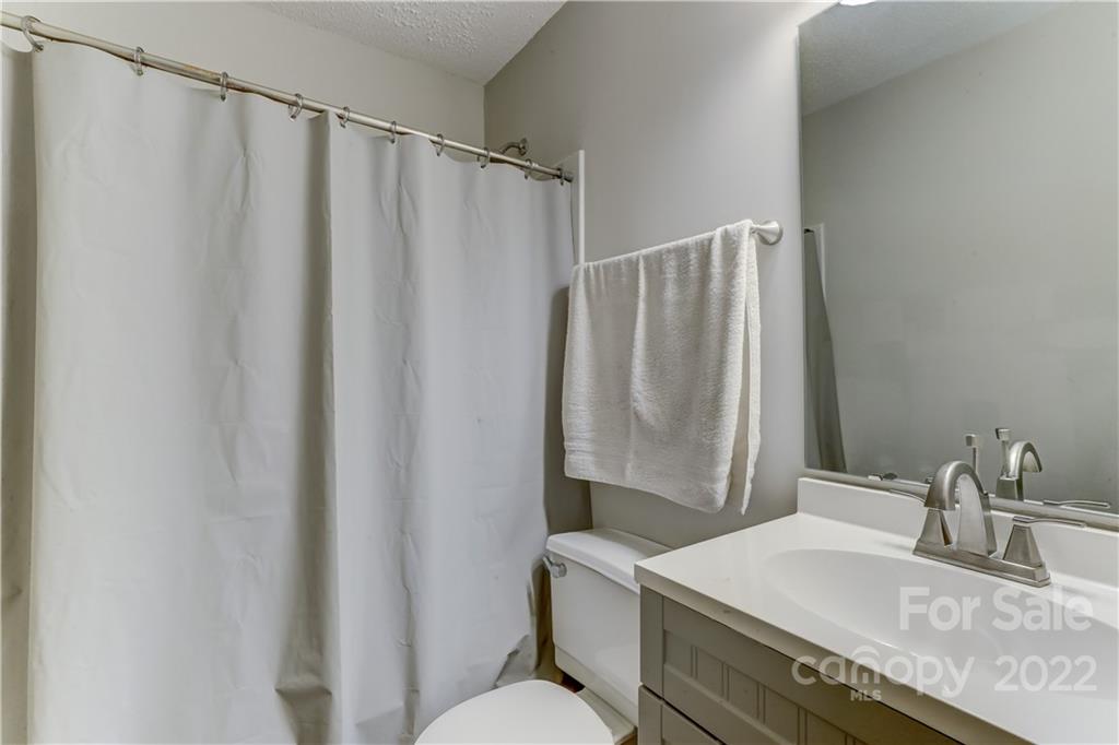 8216 Pine Oak Road Waxhaw, NC 28173 - Photo 29 of 39 a bathroom with a sink and a mirror