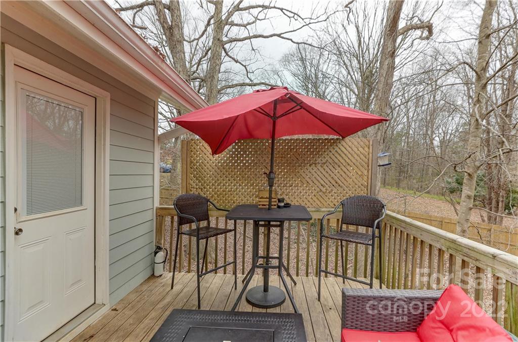 8216 Pine Oak Road Waxhaw, NC 28173 - Photo 33 of 39 a view of balcony with wooden floor and outdoor seating